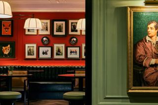 Eccentric portraits on a red wall at The Mayfair Townhouse