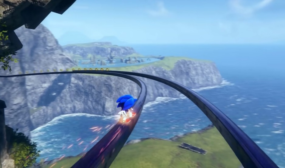 The beautiful boy sonic grinds on a rail curving around a cliff face overlooking the ocean