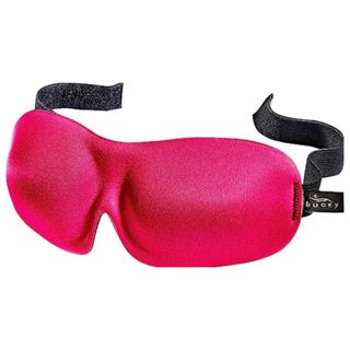 A hot pink sleep mask with black straps