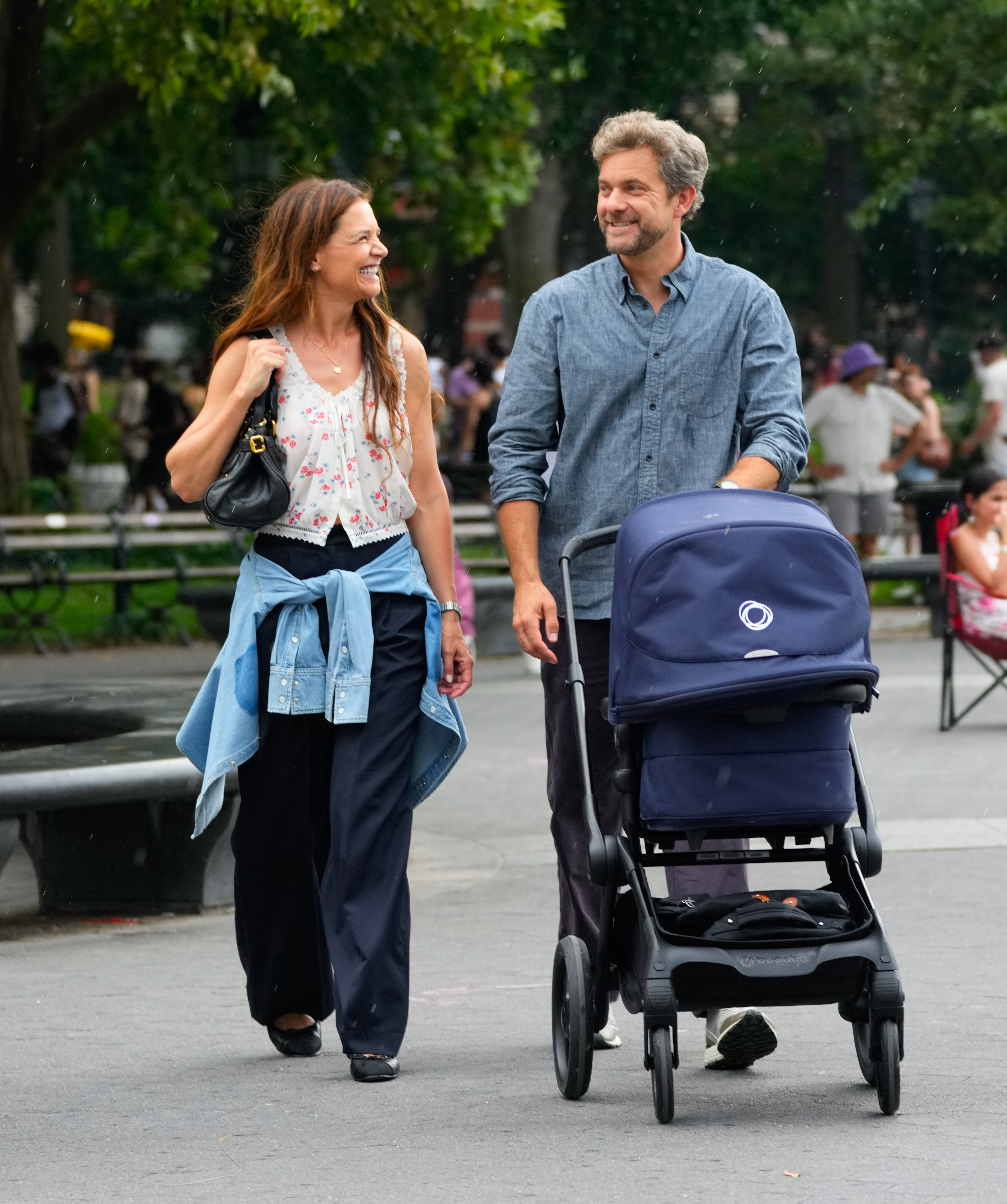 Katie Holmes wears a floral Doen shirt beloved by Taylor Swift with baggy pants and ballet pumps as she walks with former Dawson's Creek costar Joshua Jackson