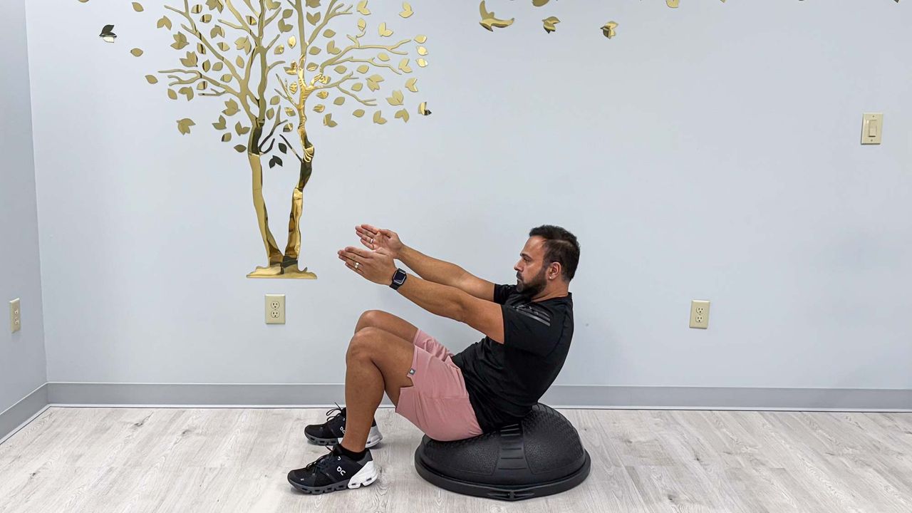 Nico Gonzalez finishing the BOSU dead bug to stand exercise