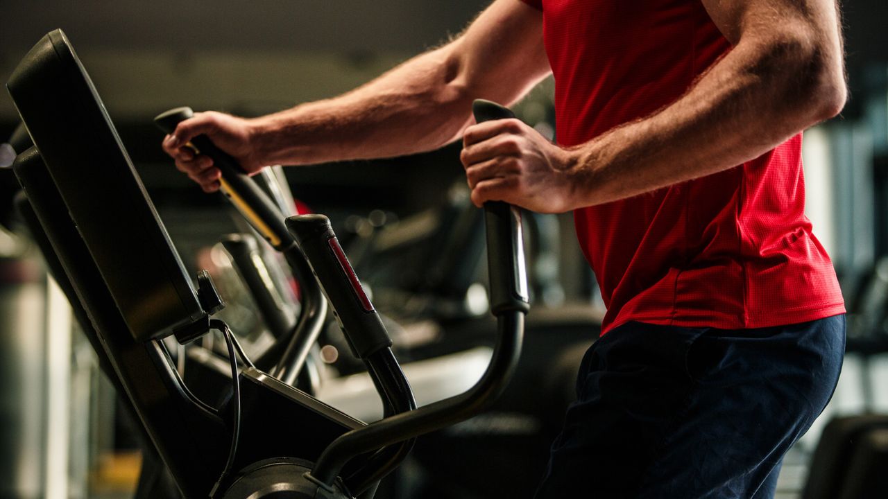 Man on best elliptical trainer doing a workout