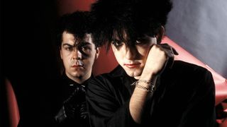 Lol Tolhurst and Robert Smith of The Cure, posed, studio portrait, 1983. 