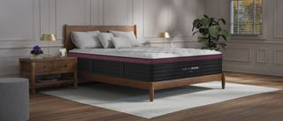 The Helix Dusk Luxe Mattress on a bed frame in a bedroom