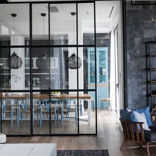 kitchen area with glass partition and dining table