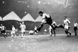 Peter Broadbent scores for Wolves against Schalke at Molineux in the first round of the European Cup, 1958