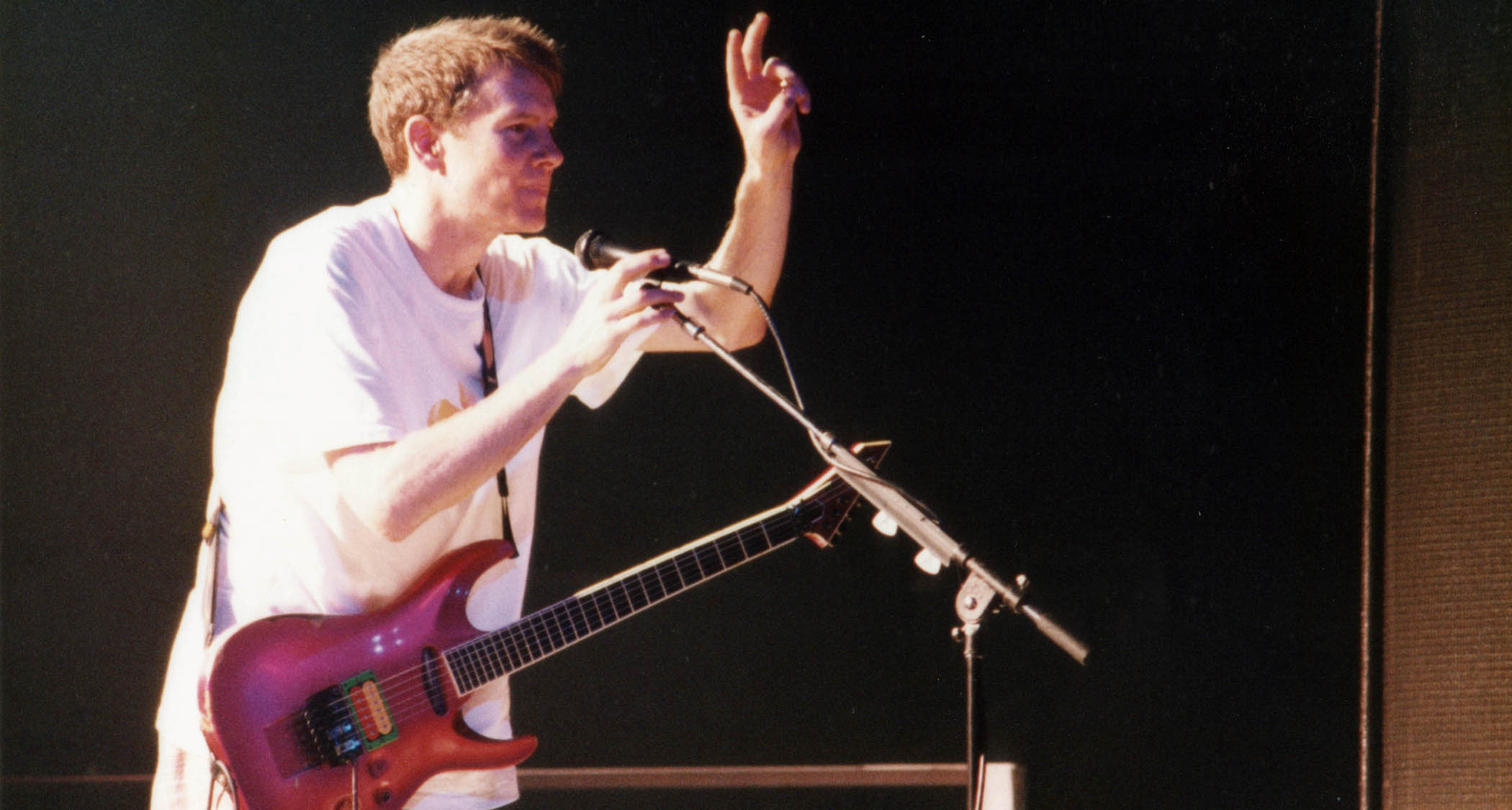 Page Hamilton onstage with Helmet with his pink/magenta ESP Horizon