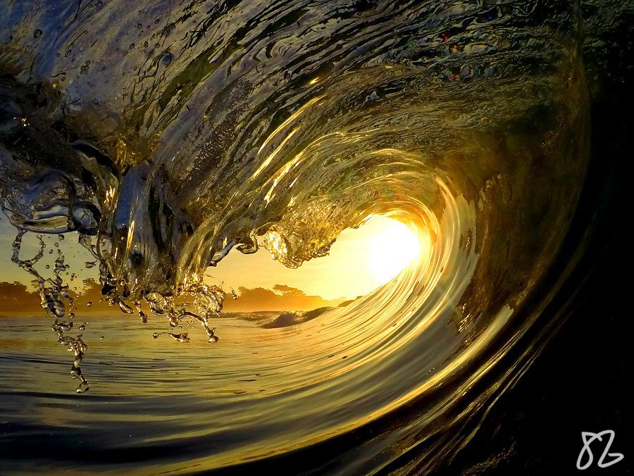 a yellow sunset and a wave near Monterey, California