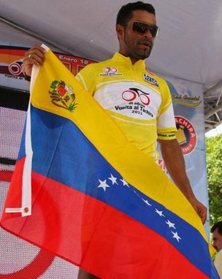 Venezuelan Miguel Ubeto displays his country's flag.