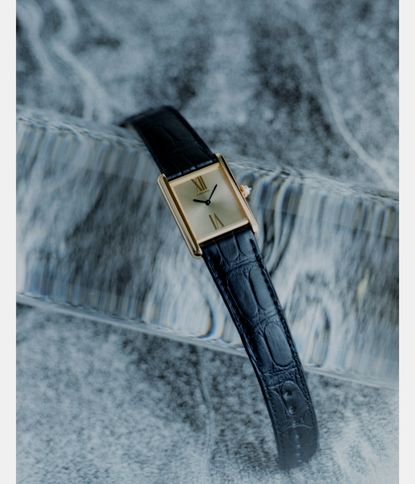 Tank Louis Cartier gold watch with blue strap