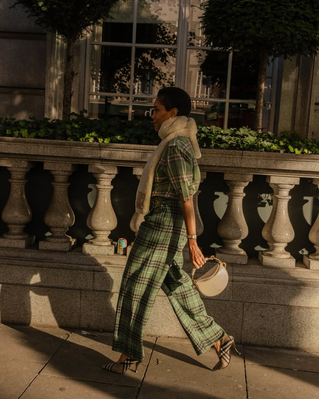 tamu wearing plaid outfit