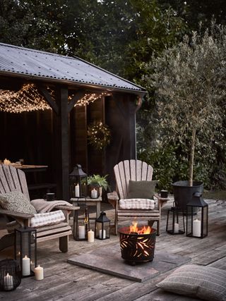 deck with adirondeck chairs and fire pit