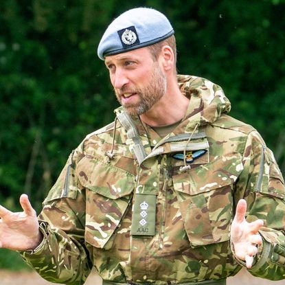 Prince William wearing camo fatigues and a beret