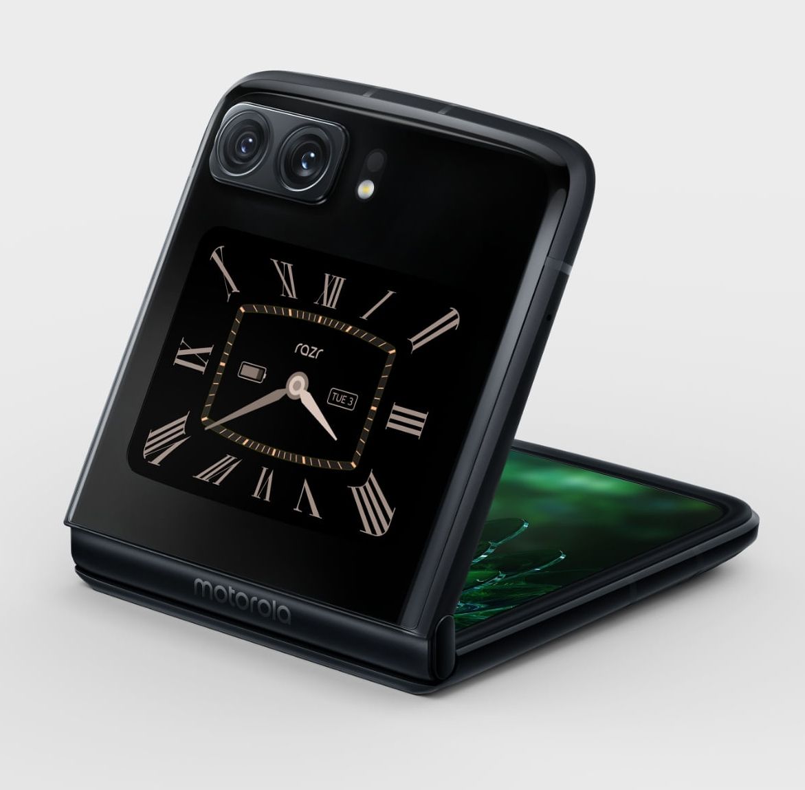 The Motorola Razr 2022 half-open with a brown clock face on the secondary display