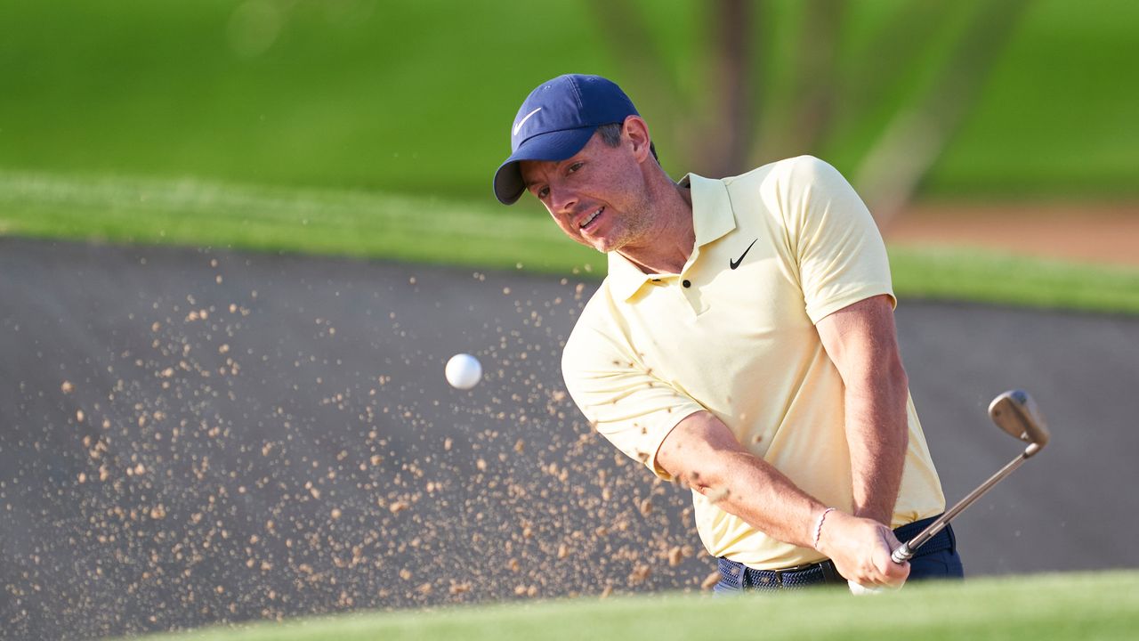 Rory McIlroy hits a bunker shot