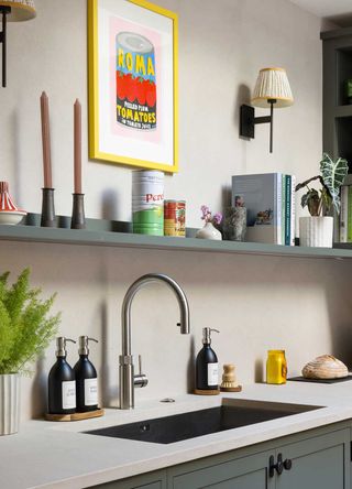 sage green kitchen with white worktops and open shelving