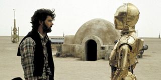 George Lucas directs C-3PO on the set of Star Wars