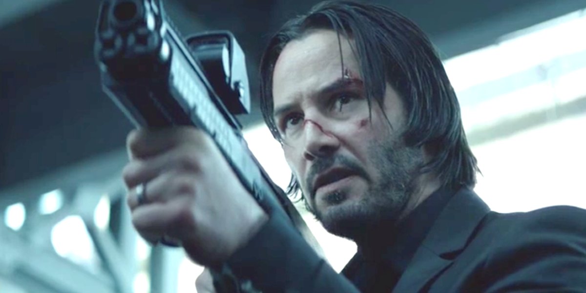 John Wick Keanu Reeves aims a cool looking gun