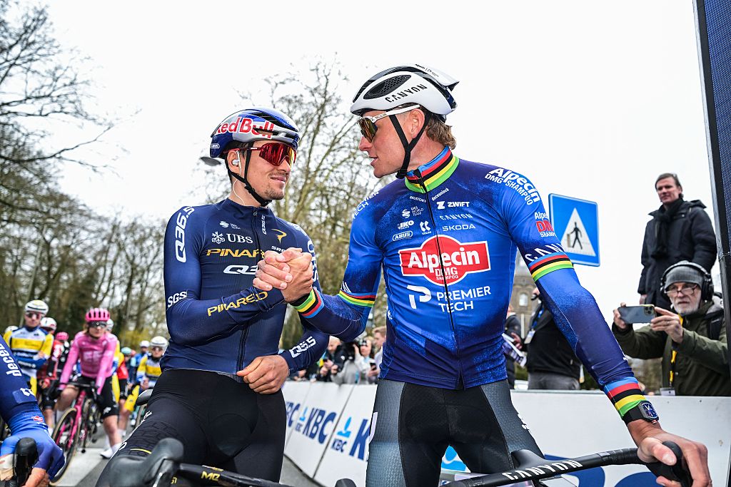 British Tom Pidcock of Pinarello Q36.5 Pro Cycling Team and Dutch Mathieu van der Poel of Alpecin-Premier Tech pictured at the start of the 81st edition of the men's one-day cycling race Omloop Het Nieuwsblad (UCI World Tour), the opening race of the Flemish one-day classics season, 207,6 km from Gent to Ninove, Saturday 28 February 2026. BELGA PHOTO DAVID PINTENS (Photo by DAVID PINTENS / BELGA MAG / Belga via AFP)