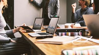 A group of people in a conference room.