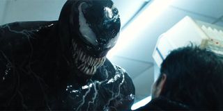 Tom Hardy's anti-hero threatening to devour a victim in Venom