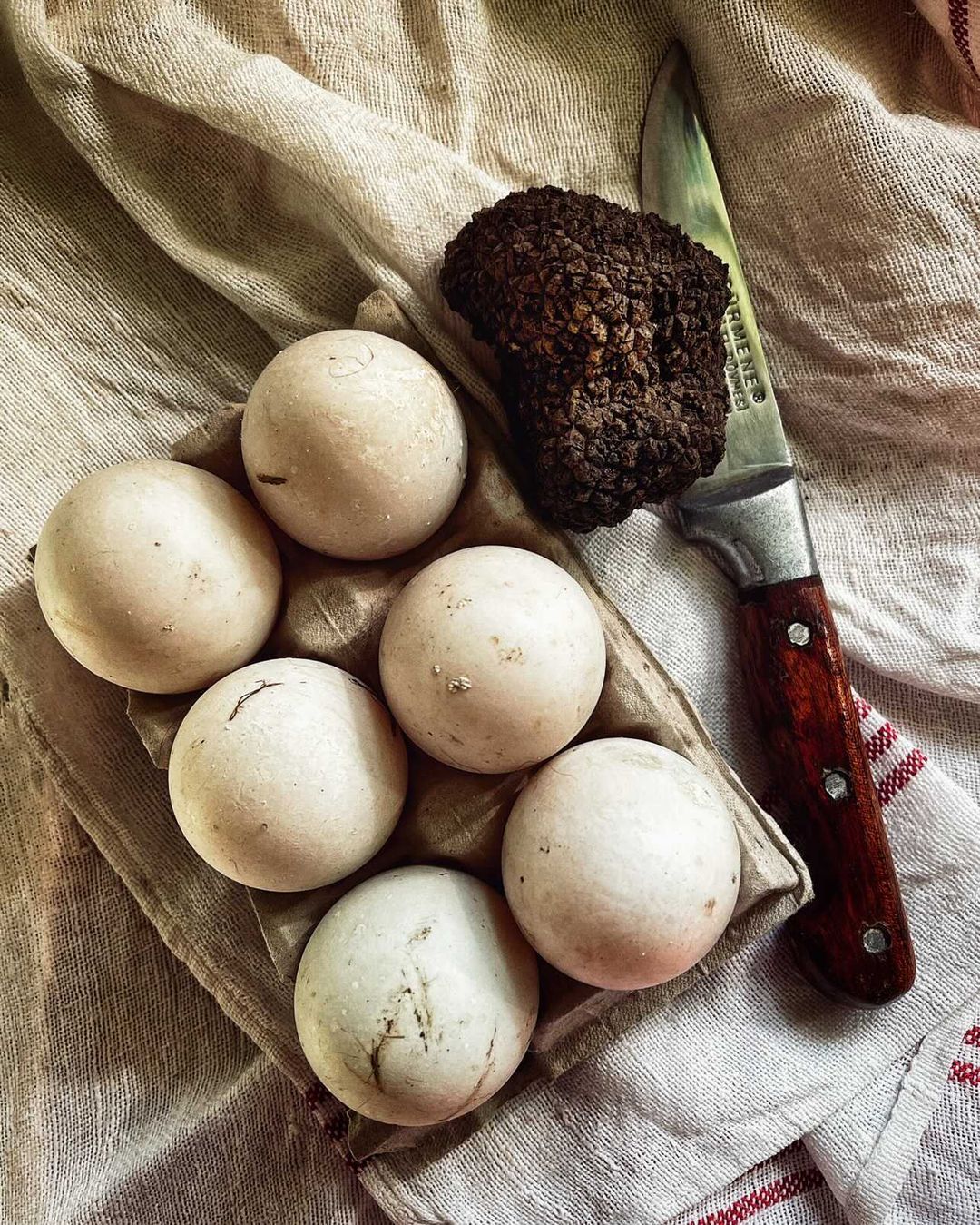 Photo of eggs alongside a knife