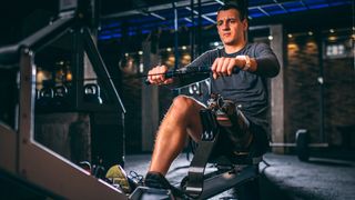 Man using a rowing machine to workout