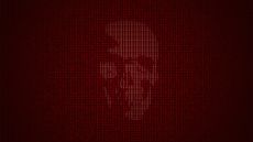 Concept image symbolizing living off the land attacks showing a faint skull symbol blending into computer source code.