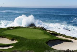 Pebble Beach 7th green pictured with a large wave from the Pacific Ocean