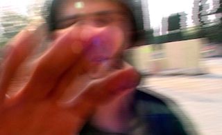 Blurred image of hand over the camera