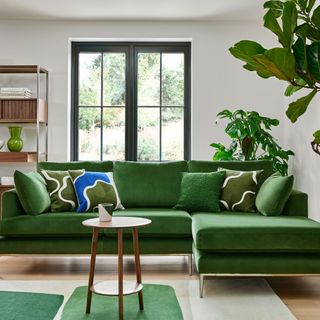 Green l-shaped sofa in living room