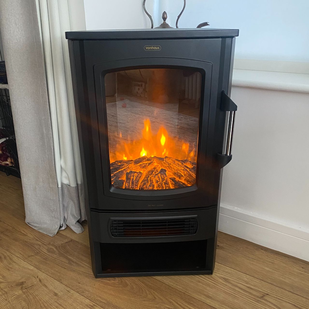 VonHaus Electric Stove &amp; Log Store, with flame effect light on in daylight
