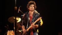 British musician Keith Richards of the band The Rolling Stones performs on stage during a North American tour, 1981