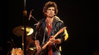 British musician Keith Richards of the band The Rolling Stones performs on stage during a North American tour, 1981