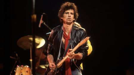 British musician Keith Richards of the band The Rolling Stones performs on stage during a North American tour, 1981