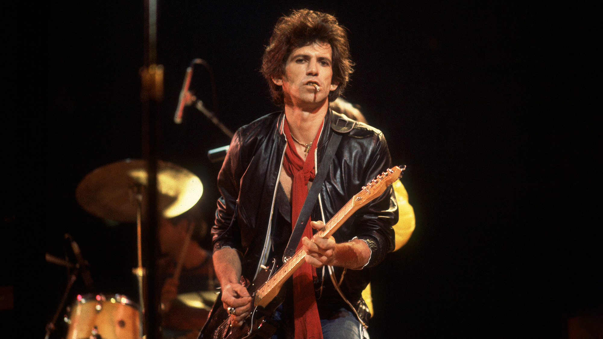 British musician Keith Richards of the band The Rolling Stones performs on stage during a North American tour, 1981