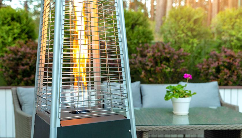 Patio heater on patio with outside furniture