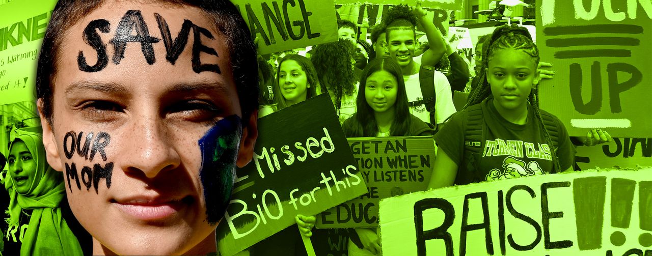 Climate kids carrying environmental posters