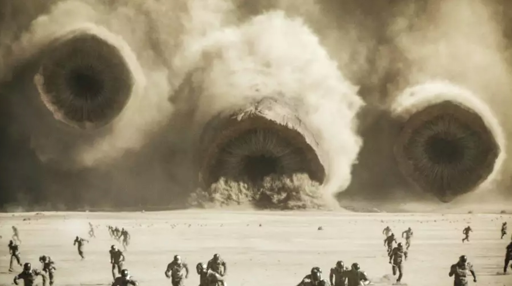 Giant worms erupt from the sand on an alien planet
