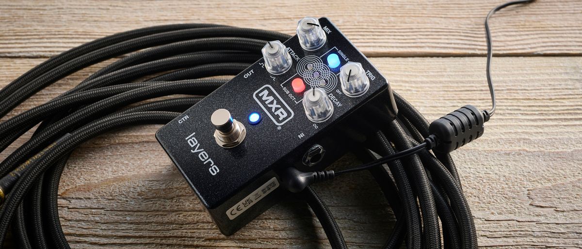 MXR Layers pedal in metallic black finish with clear controls pictured on wood floor with coiled guitar cable