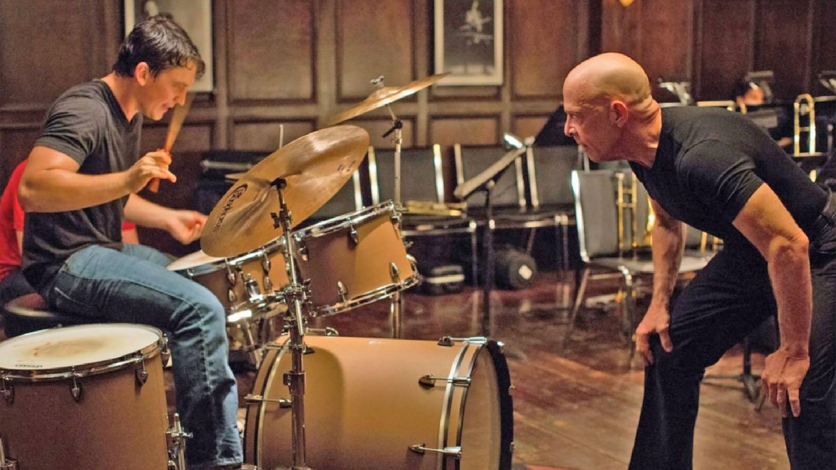 Miles Teller as Andrew Neiman and J. K. Simmons as Terence Fletcher in Whiplash