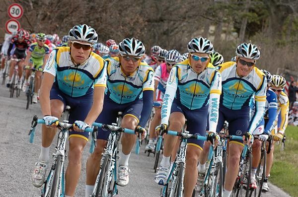Astana riders work together on the front of the main bunch.