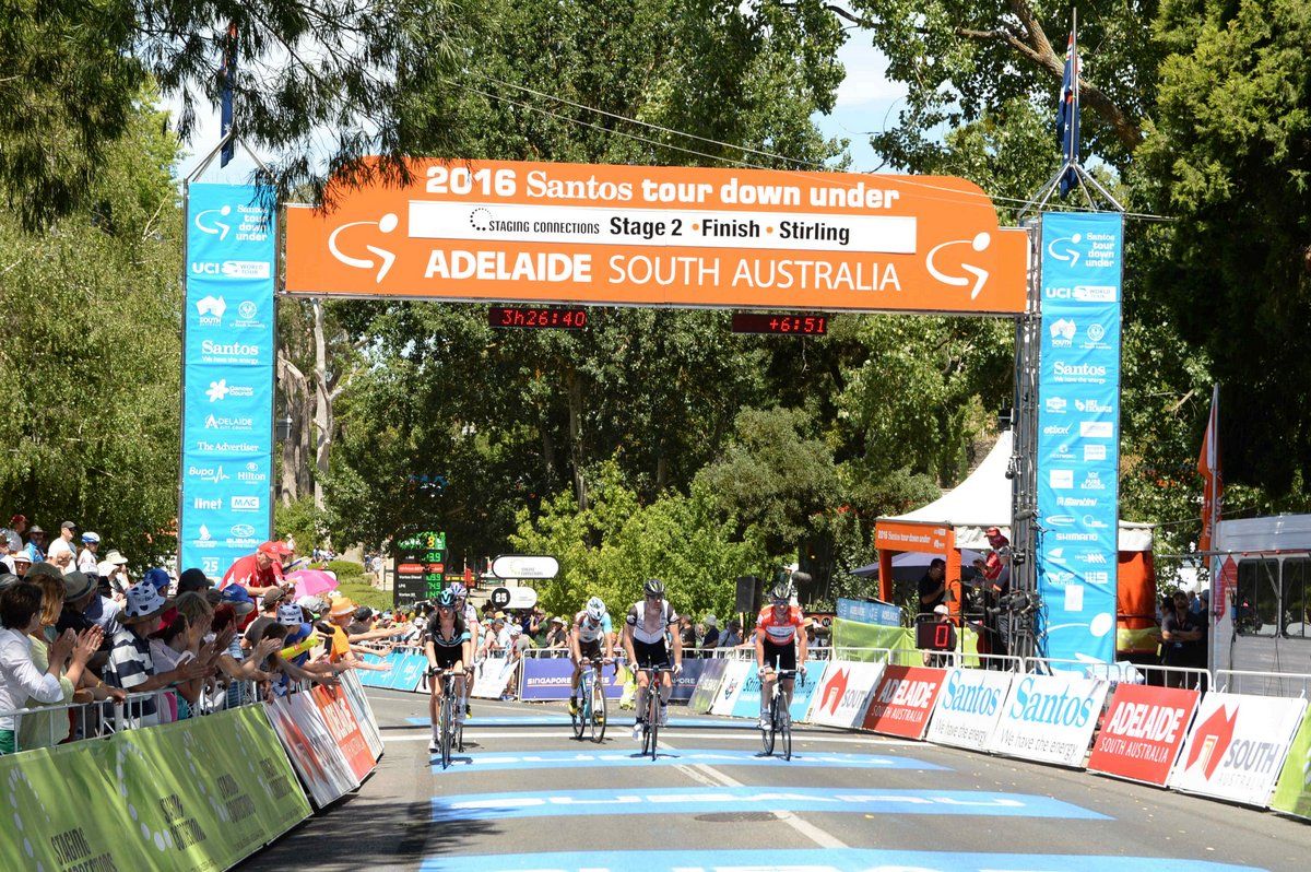Riders held up in the crash cross the line