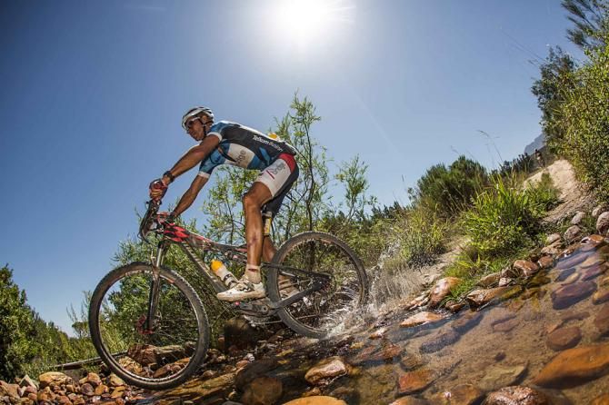 Nico Pfitzinmeier makes his way through a rocky river crossing