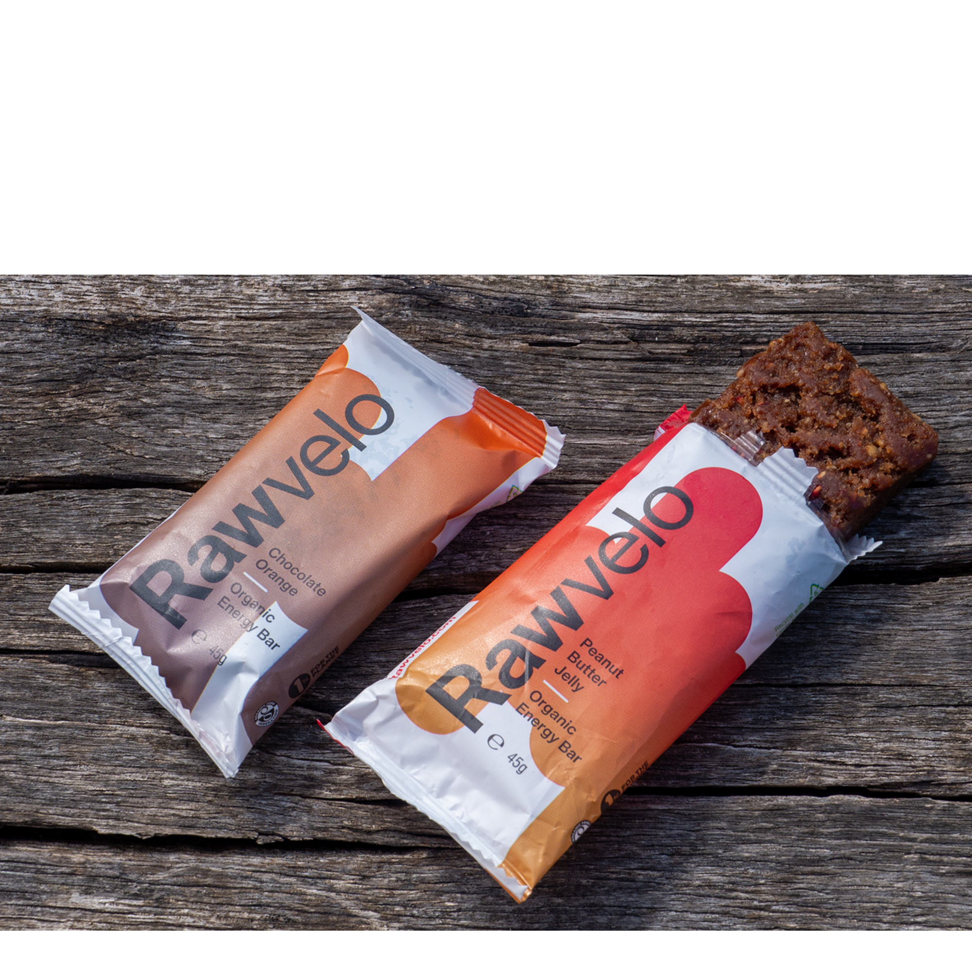 A pair of rawvelo energy bars on a wooden bench