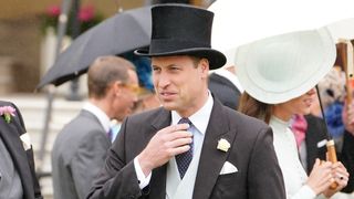 Prince William, Duke of Cambridge meets guests during a Royal Garden Party at Buckingham Palace on May 25, 2022