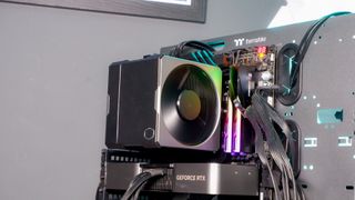 A Cooler Master Hyper 612 Apex on a desk and installed on a gaming PC.