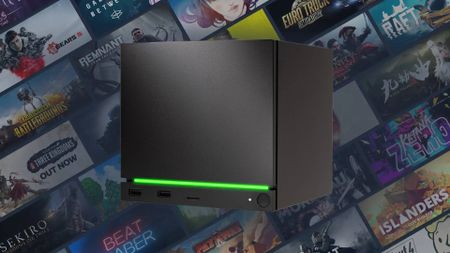 Steam Machine with green lightbar and artwork grid in backdrop.