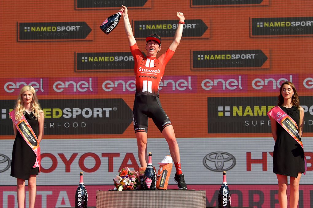 Chad Haga on the 2019 Giro d'Italia podium after winning the final time trial