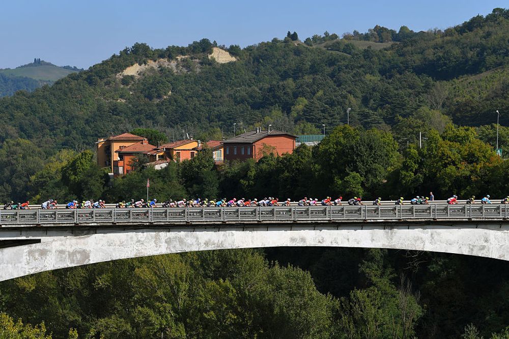The peloton cross a bridge during the Giro dell'Emilia
